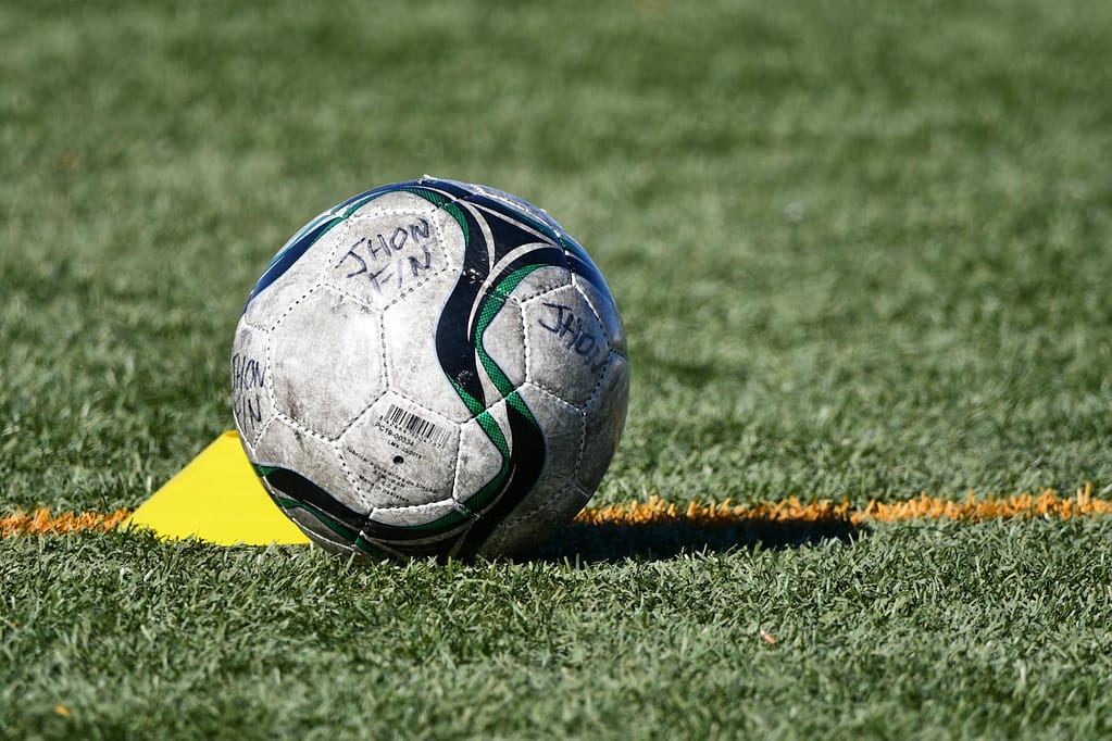 soccer ball on grass field during daytime