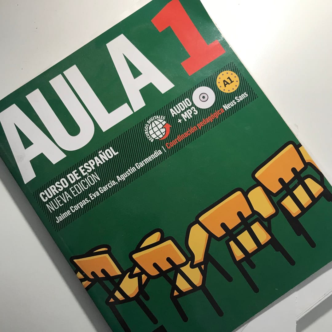 Cover of a Spanish learning textbook titled "Aula 1" (classroom one).
