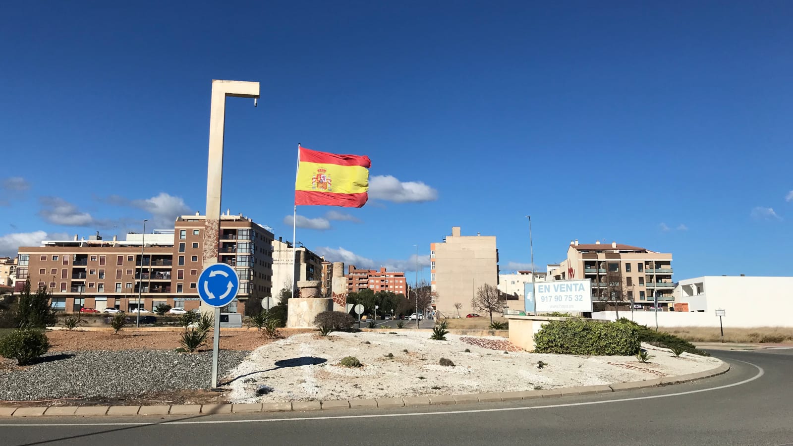 The Spanish flag flying in a roundabout