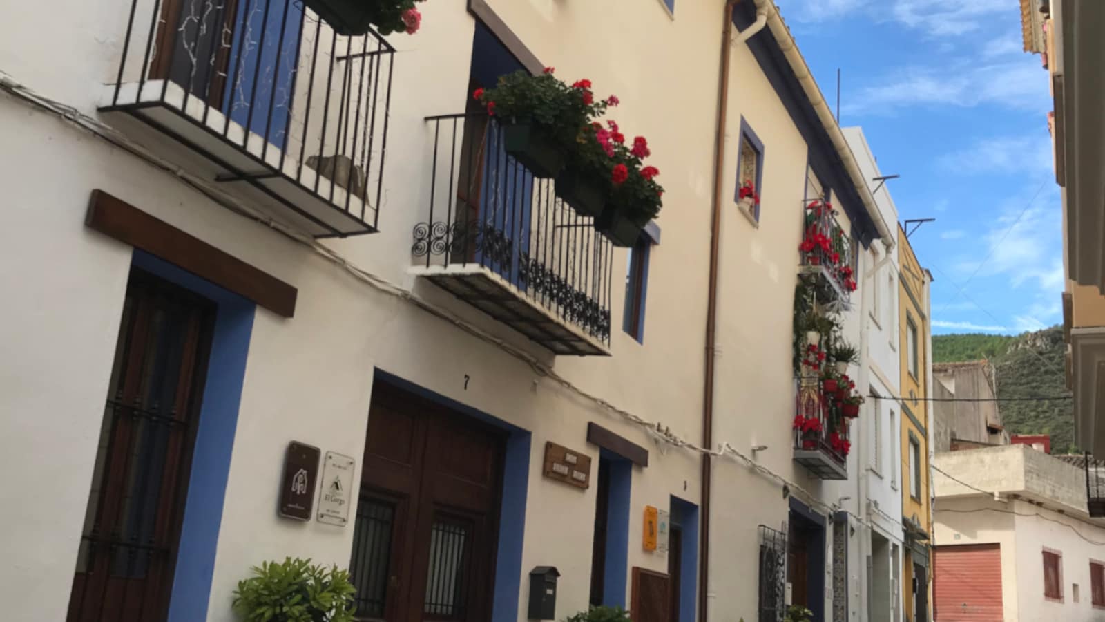 Balconies decorated with poinsettias and other flowers in Gátova.