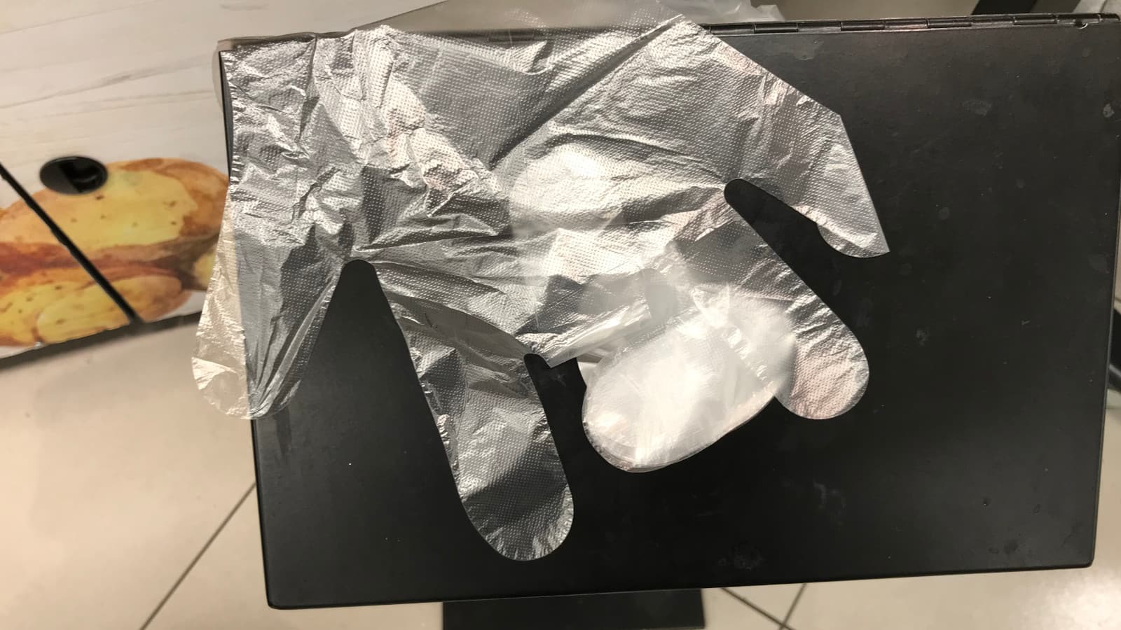 Clear, plastic glove for handling the produce.