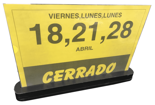 Sign showing dates of closure at Valencian supermarket over transparent background.