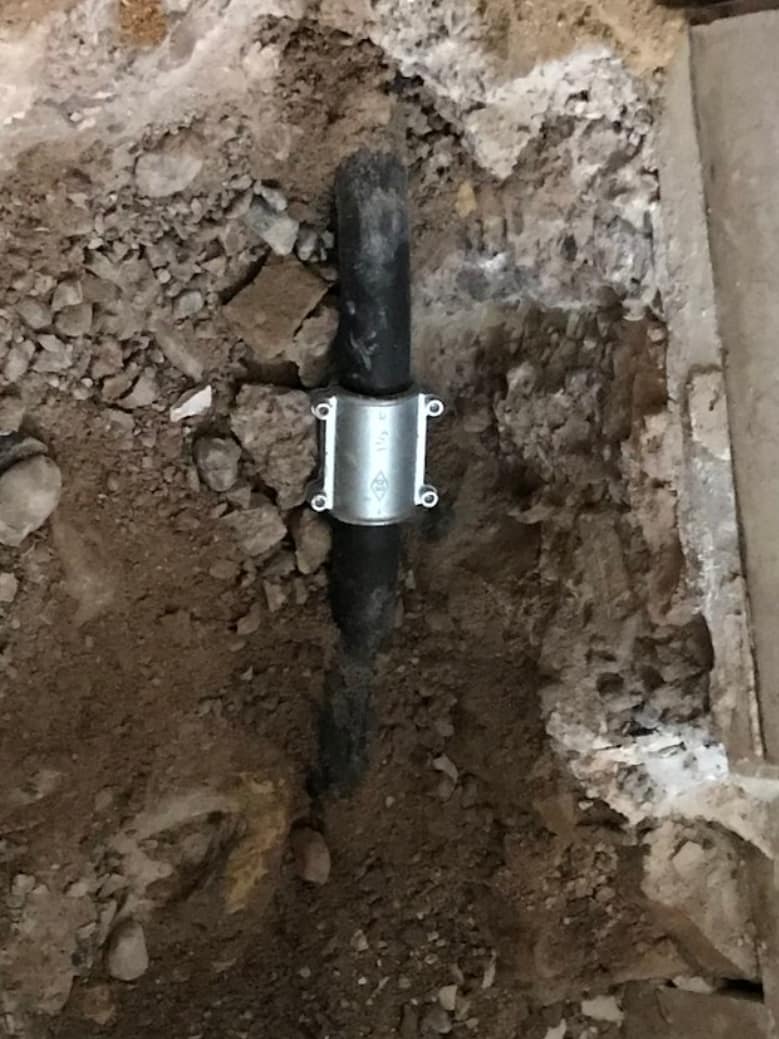Pipe uncovered during the renovation of the ramp leading to the elevator.