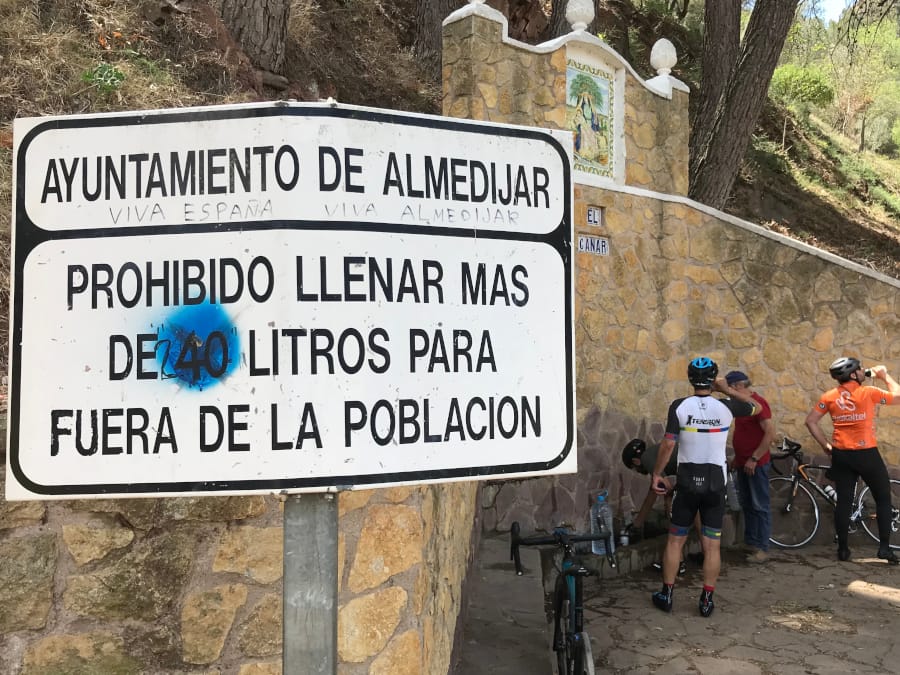 A sign in the foreground telling people not to exceed a set amount of liters.